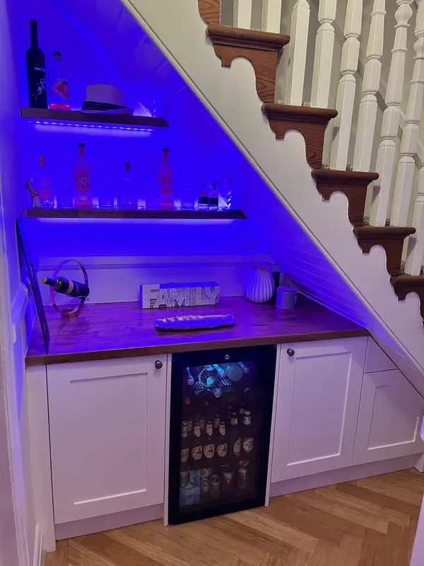 custom built bar under stairs